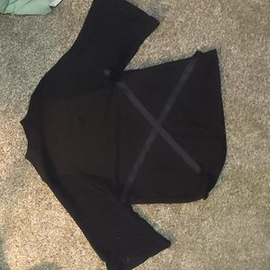 very oversized black shirt with ribbon on the waist and crocheted sleeves